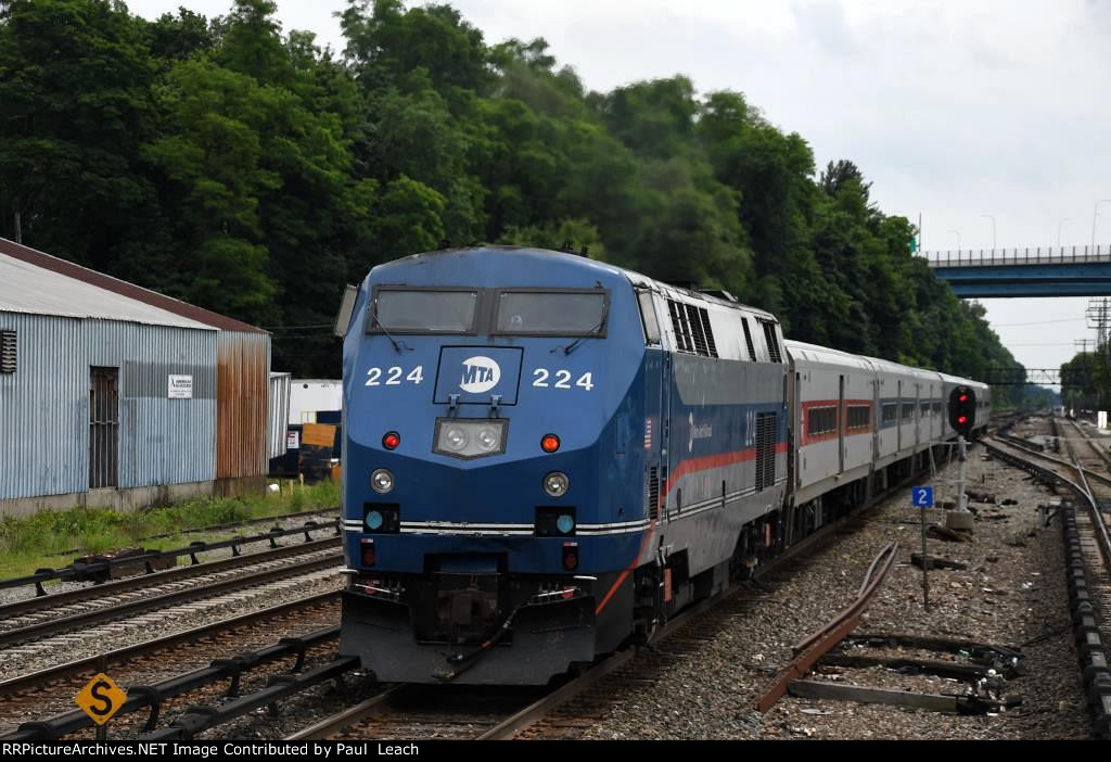 Inbound commuter shoves out of its station stop